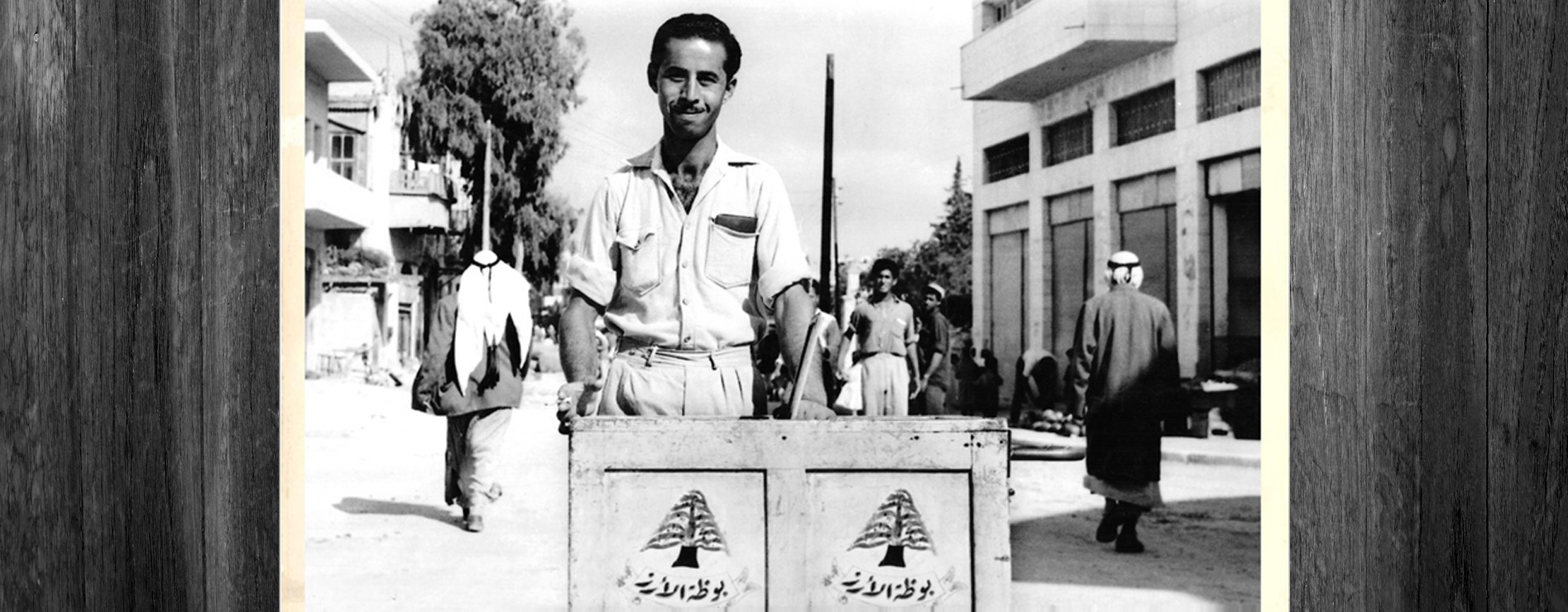 Vintage black-and-white photograph of the founder, Mohammad Anabtawi, with his ice cart in old Nablus